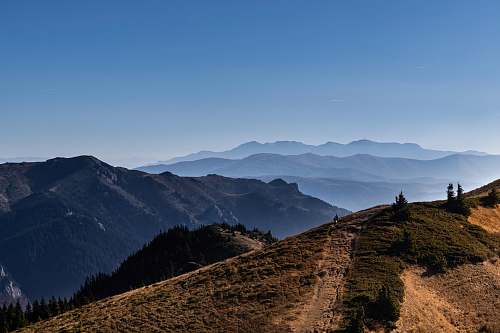 mountain range green grass field mountain nature